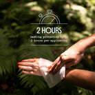 Person applying a repellent wipe to their arm with text about 2-hour protection, against a green leafy background.