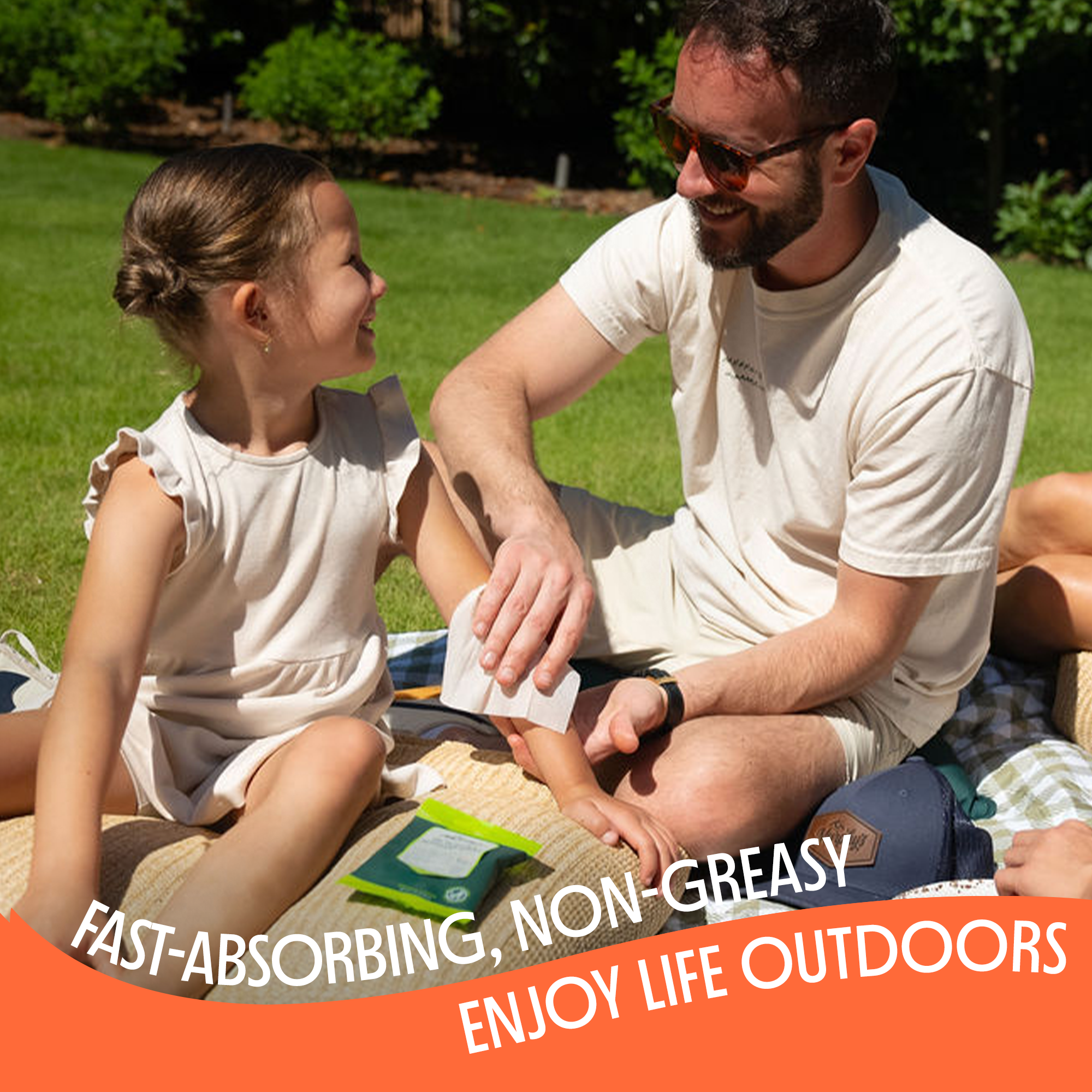 Man and young girl sitting on grass outdoors with text about Repellent wipes product benefits