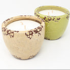 an ivory and green ceramic garden candle