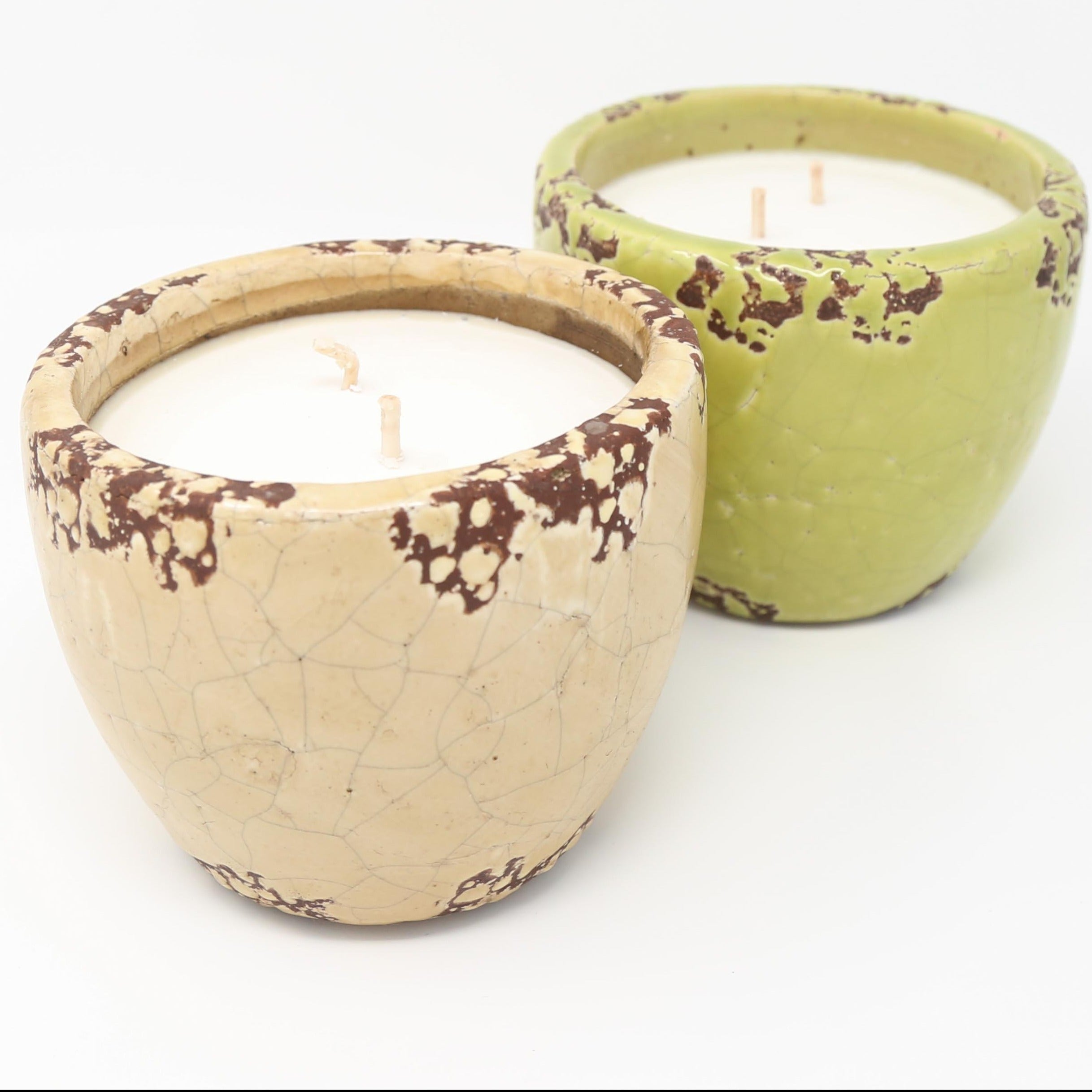 an ivory and green ceramic garden candle
