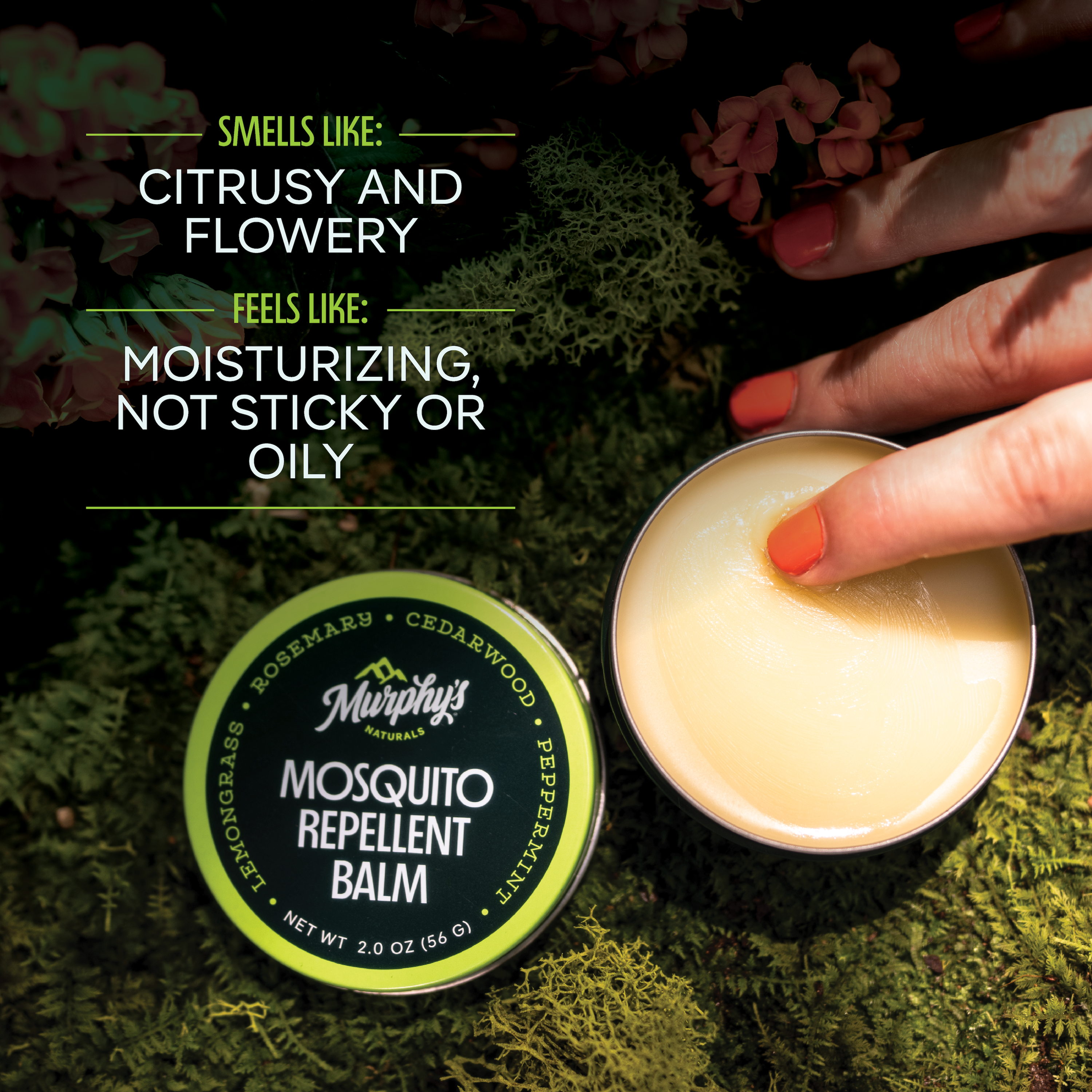 Mosquito Repellent Balm on a mossy log with a persons finger picking up product