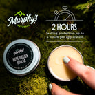 Murphy's Naturals Bite Relief Balm with a hand applying balm on a green natural background