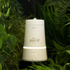 Dodger device surrounded by up close greenery including pothos leaves adn ferns. 