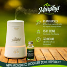 Murphy's Naturals mosquito repellent device with plant-based oils on a wooden surface.