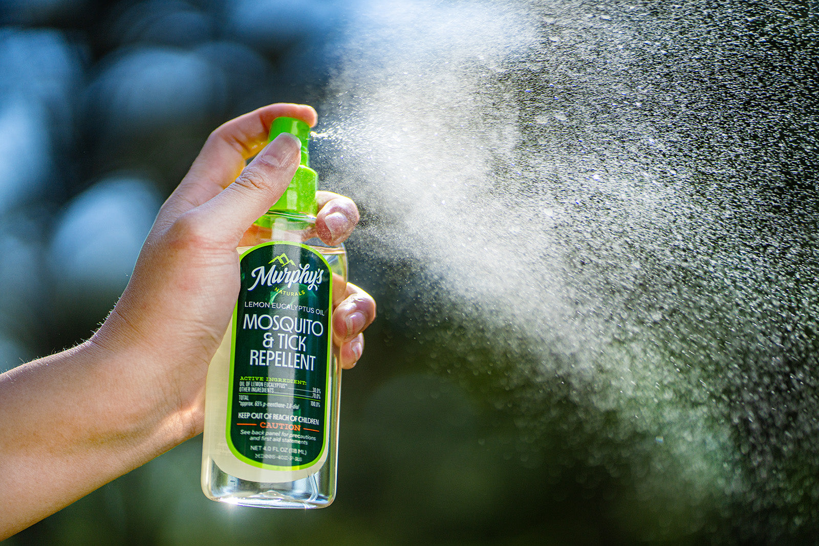 Murphy's Naturals Lemon Eucalyptus Oil Spray being sprayed into the light